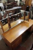 A Heals dressing table, circa 1960 with a triple plate mirror and four drawers 153cm wide