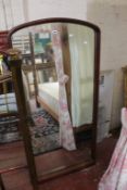An arched shaped mahogany framed  mirror from a cheval mirror.
