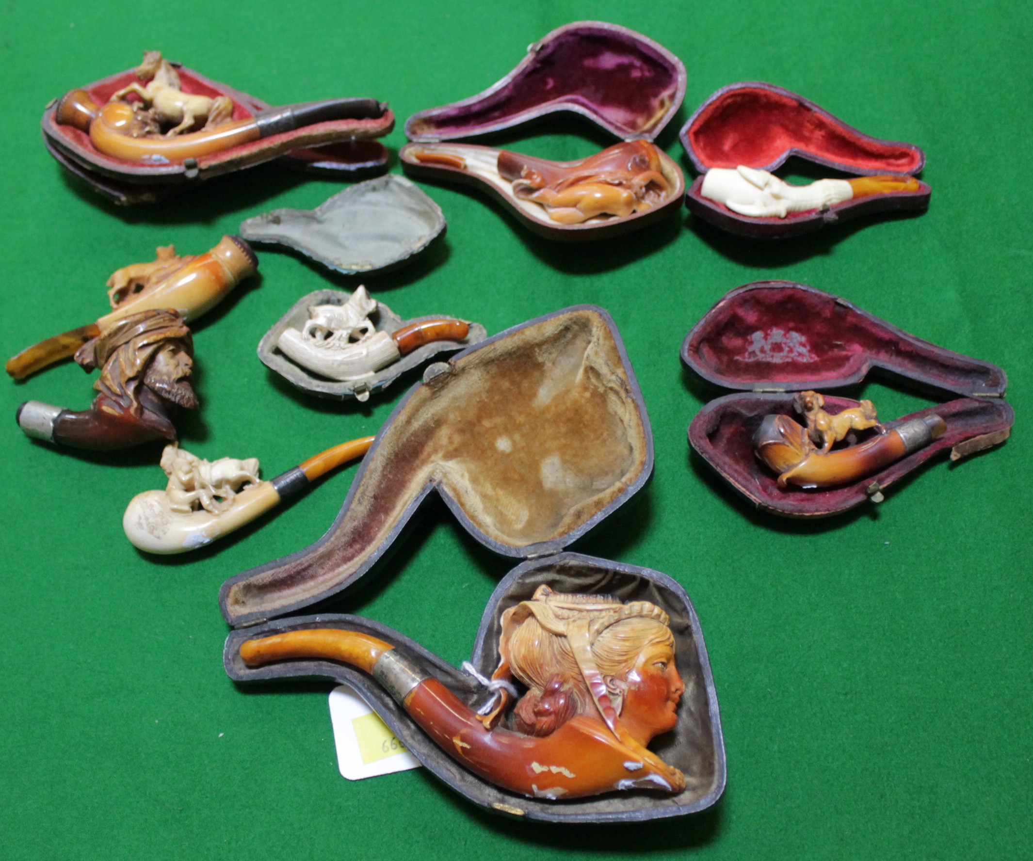 A mixed group of carved pipes to include Meersham examples, all held in cases