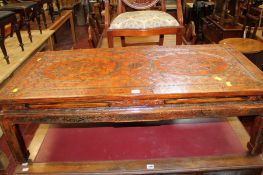 Chinese hardwood low table in an ochre finish.