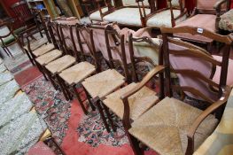 A set of six ladder back chairs, , with pierced rails and two similar carvers (8)