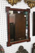 A mahogany and parcel gilt mirror with re-entrant corners 52 x 41cm