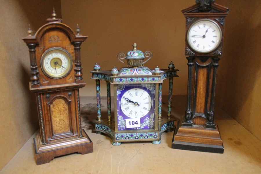 Two Edwardian walnut mantel timepieces modelled as miniature longcase clocks, each with French