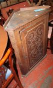 A George II oak hanging corner cupboard. Best Bid