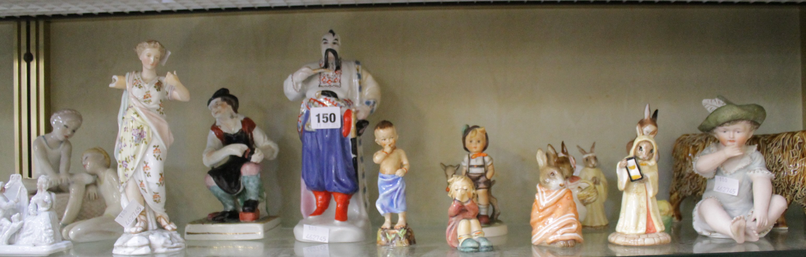 A Royal Doulton `Reflections` (HN3134) model, together with Royal Doulton Bunnykins models, a Royal