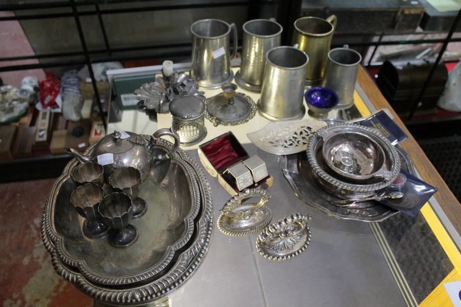 A group of silver plated items to include cased sets of flatware, pewter tankards, tray etc.