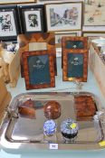 A graduated set of three Mulberry Home frames, a further frame, two glass paperweights, a silver