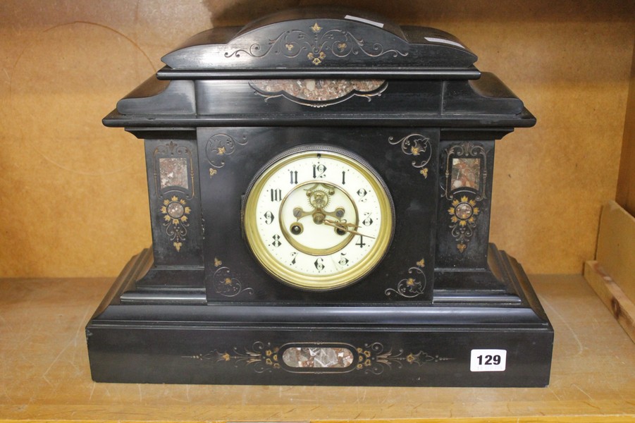 A French Belge noir marble mantel clock, the eight-day gong striking movement with visible Brocot