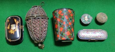 A tortoiseshell oblong purse, with a brass inlaid band and shield shaped reserve, 7.9cm long; a