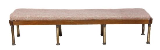 A long mahogany hall bench raised on six fluted column legs. 218cm long.