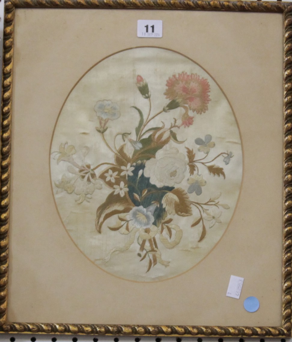 18th Century School Floral embroidered panel, oval 26 x 23.5 cm