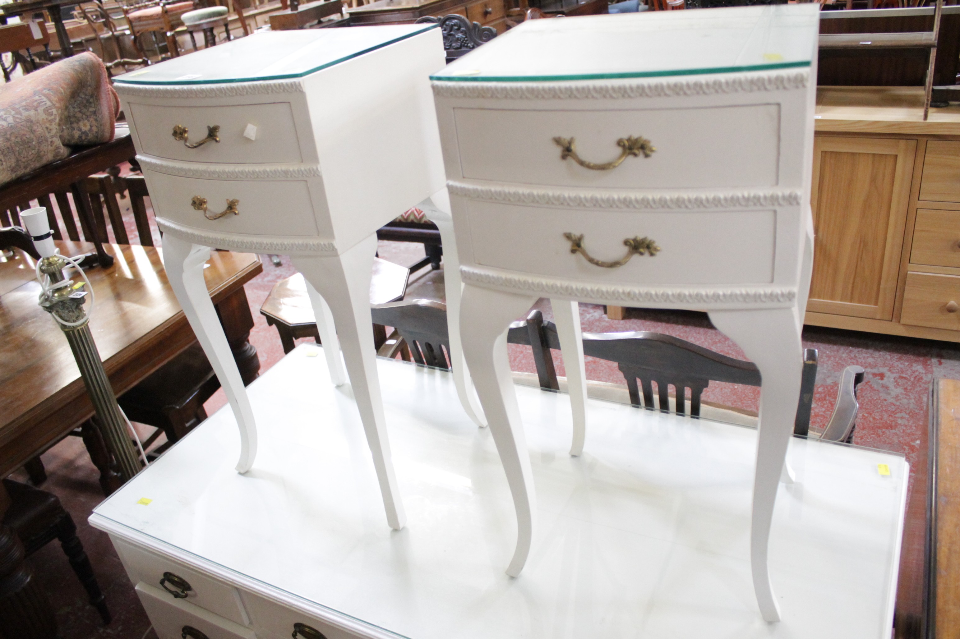A white painted dressing table and stool, together with two bedside chests  Best Bid