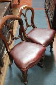 A set of five Victorian mahogany dining chairs with pierced shaped splats on turned and fluted