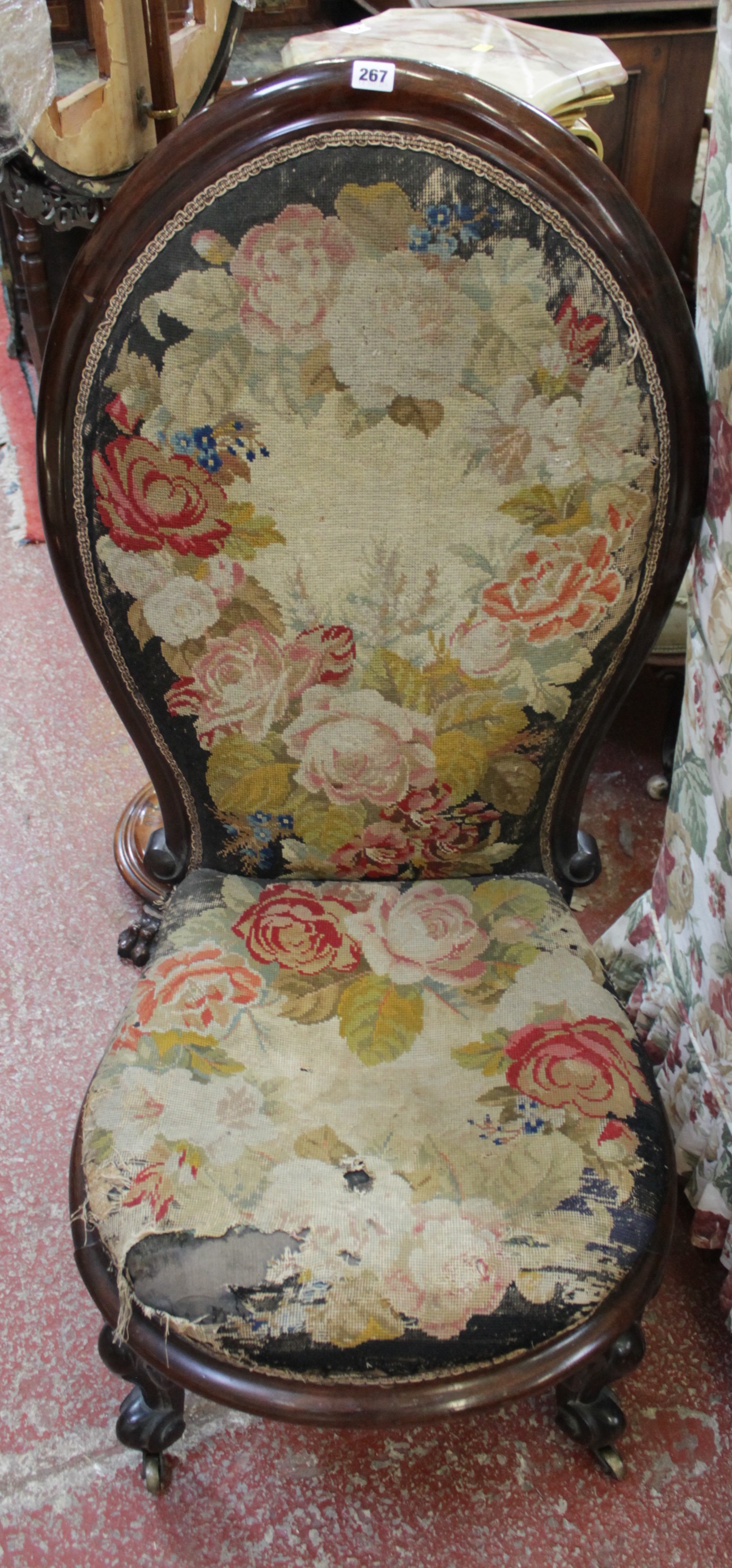 A Victorian mahogany spoonback needlework upholstered chair