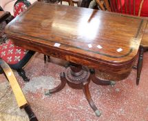 A Regency Century card table mahogany and rosewood banded fold over top on a quadruped base.