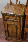 A Victorian walnut bedside cabinet, stamped H.OGDEN, MANCHESTER fitted a drawer with cupboard