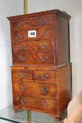 An 18th Century style walnut miniature tallboy chest, 20cm wide x 37cm high