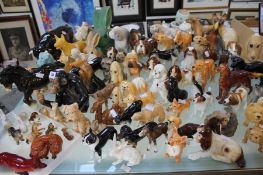 A large mixed quantity of Sylvac and other animal models including a Beswick recumbent fox etc.