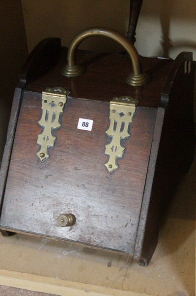 A mahogany coal purdonium having brass appliqué decoration and associated shovel Best Bid