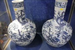 A large pair of modern Chinese blue white vases decorated with dragons; 61cm high each