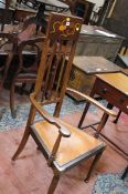 An Edwardian high back side chair in the Arts and Crafts style.