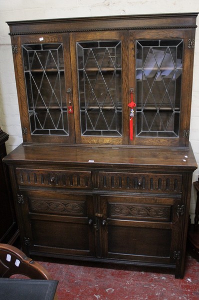 A 17th Century style glazed oak sideboard 123cm wide Best Bid