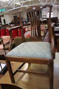A George III elm open armchair of Chippendale design Best Bid