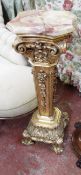 A marble topped giltwood Italianate torchere 98cm high