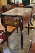 A Victorian mahogany work table with dropsides and two drawers.