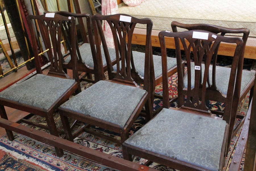 A set of six early 19th Century mahogany dining chairs with pierced splat and drop in seat