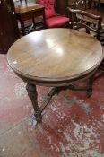 A Victorian walnut circular hall table.