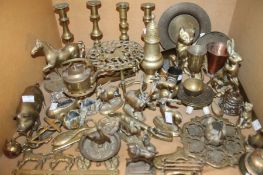 A mixed quantity of brassware to include candlesticks, figures, a three tier plant stand, a copper