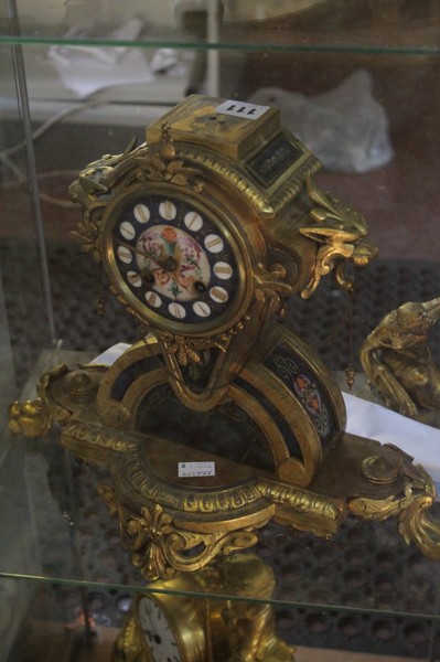 A French porcelain inset gilt metal mantel clock, late 19th century, the eight-day bell striking