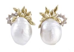 A pair of baroque cultured pearl and diamond ear studs, the ovoid cultured pearls with foliate