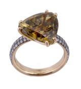 A chrysoberyl and diamond ring, the triangular fancy cut chrysoberyl, stated to weigh 9.80 carats, i