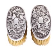 A pair of Chinese export silver oval gentleman`s hairbrushes by Wang Hing & Co., Canton & Hong