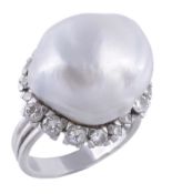A baroque cultured pearl and diamond cluster ring, the large baroque cultured pearl within a