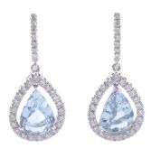 A pair of aquamarine and diamond earrings, the pear shaped fancy cut aquamarine, estimated to