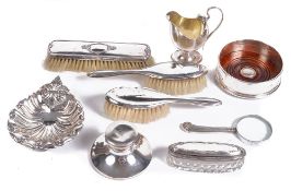 A collection of silver items, to include: a wine coaster by M. C  A collection of silver items,   to