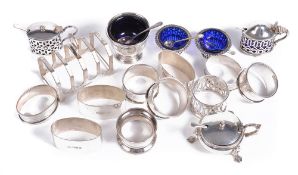 A collection of silver condiment items, including  A collection of silver condiment items,