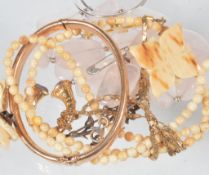 A rose quartz necklace, set with thirteen tumbled pieces of rose quartz; a...  A rose quartz