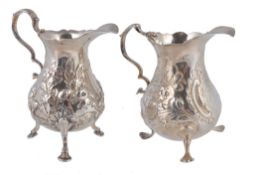 Two George II or III silver baluster cream jugs, the first with worn marks  Two George II or III