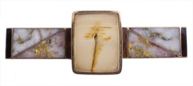 An agate panel brooch, the central rectangular panel collet set with a...  An agate panel