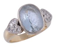 An aquamarine and diamond ring, the oval shaped aquamarine in a collet setting  An aquamarine and