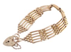 A 9 carat gold five bar gate link bracelet  A 9 carat gold five bar gate link bracelet,   with a 9