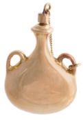 A gold coloured scent bottle, unmarked, the twin handled flask with a screw stopper, 4.2cm (1 ?in)