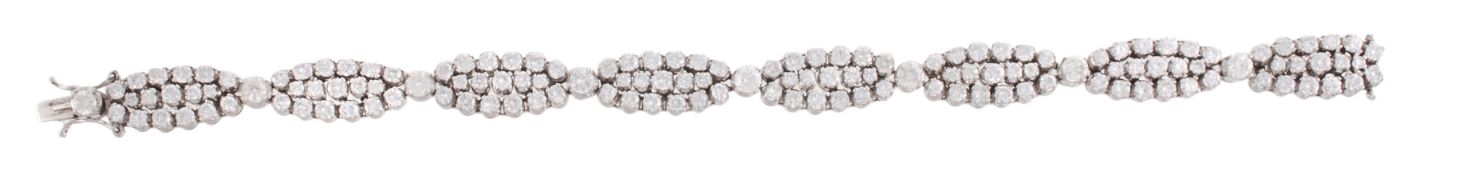 A diamond bracelet, the articulated bracelet composed of marquise shaped panels set throughout with