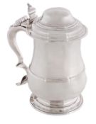 A late George II silver baluster tankard by William Shaw & William Priest, London 1755, the double