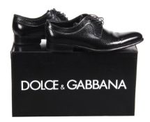 A pair of Dolce & Gabbana men`s shoes, in imitation lizard high gloss leather, with laced front,