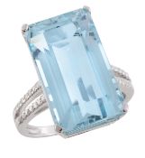 An aquamarine and diamond ring, the rectangular step cut aquamarine, estimated to weigh11.16